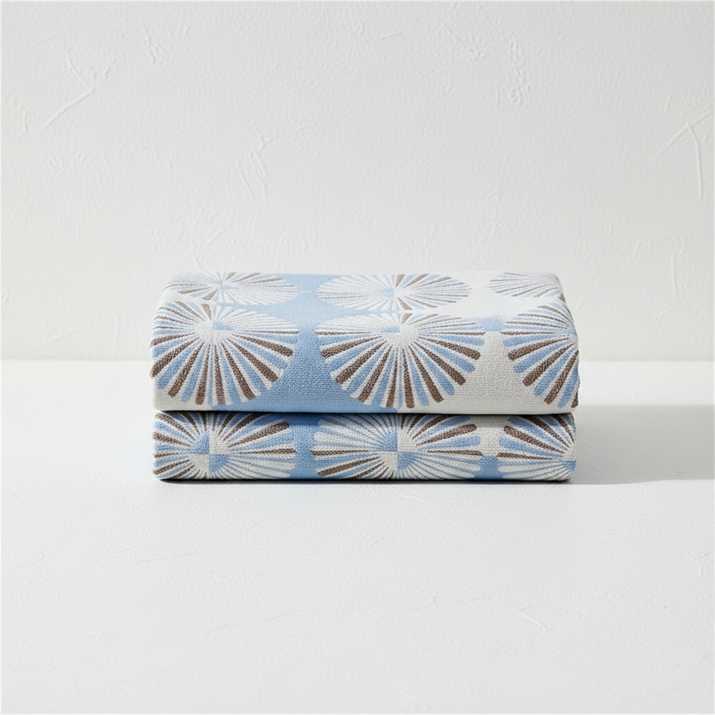 Dahlia Blossom bath towel blue folded