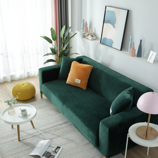 Dark Green velvet stretch sofa slipcover fully fitted in a modern living room