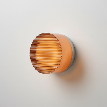 Luminara Style A orange ribbed glass wall sconce studio packshot