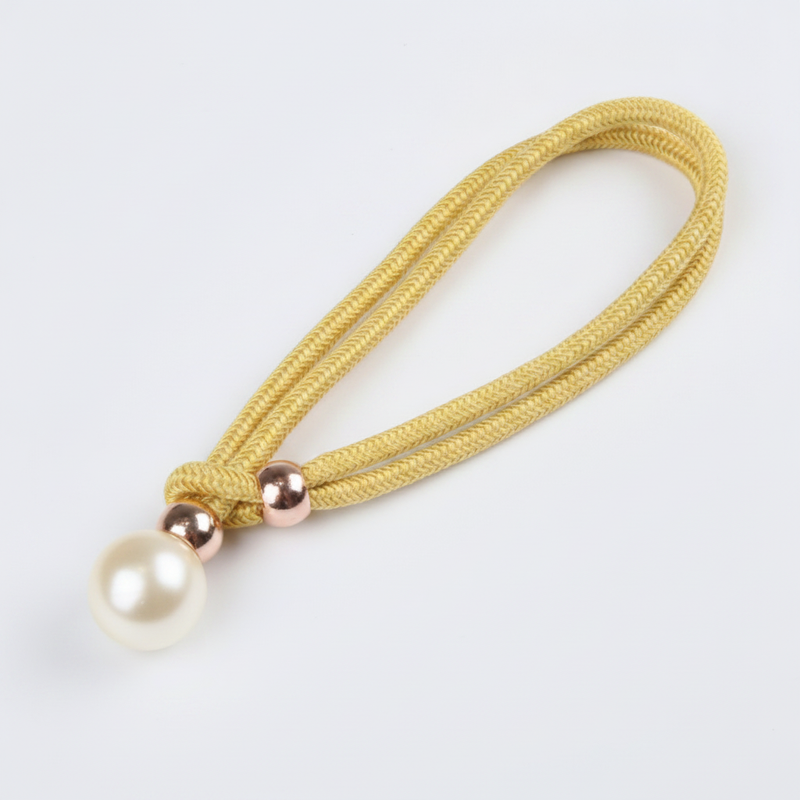 Golden lustrous pearl curtain tie-back packshot