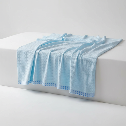 Blue Sky waffle cotton summer blanket draped