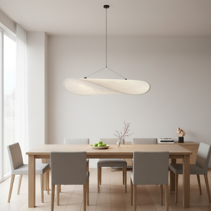 SailLight sail-shaped pendant installed over a modern dining table - lifestyle
