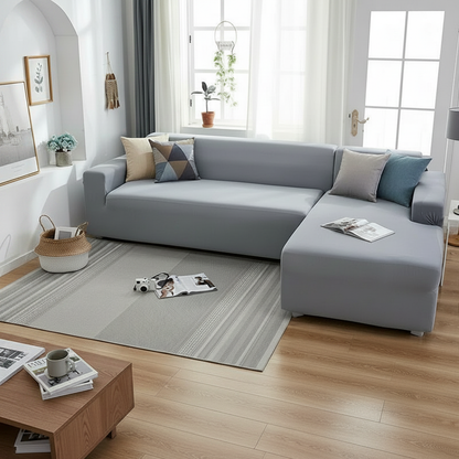 Mouse grey L-shaped sofa slipcover styled in a modern living room