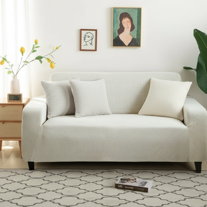 Narrow jacquard white couch slipcover styled in a modern living room