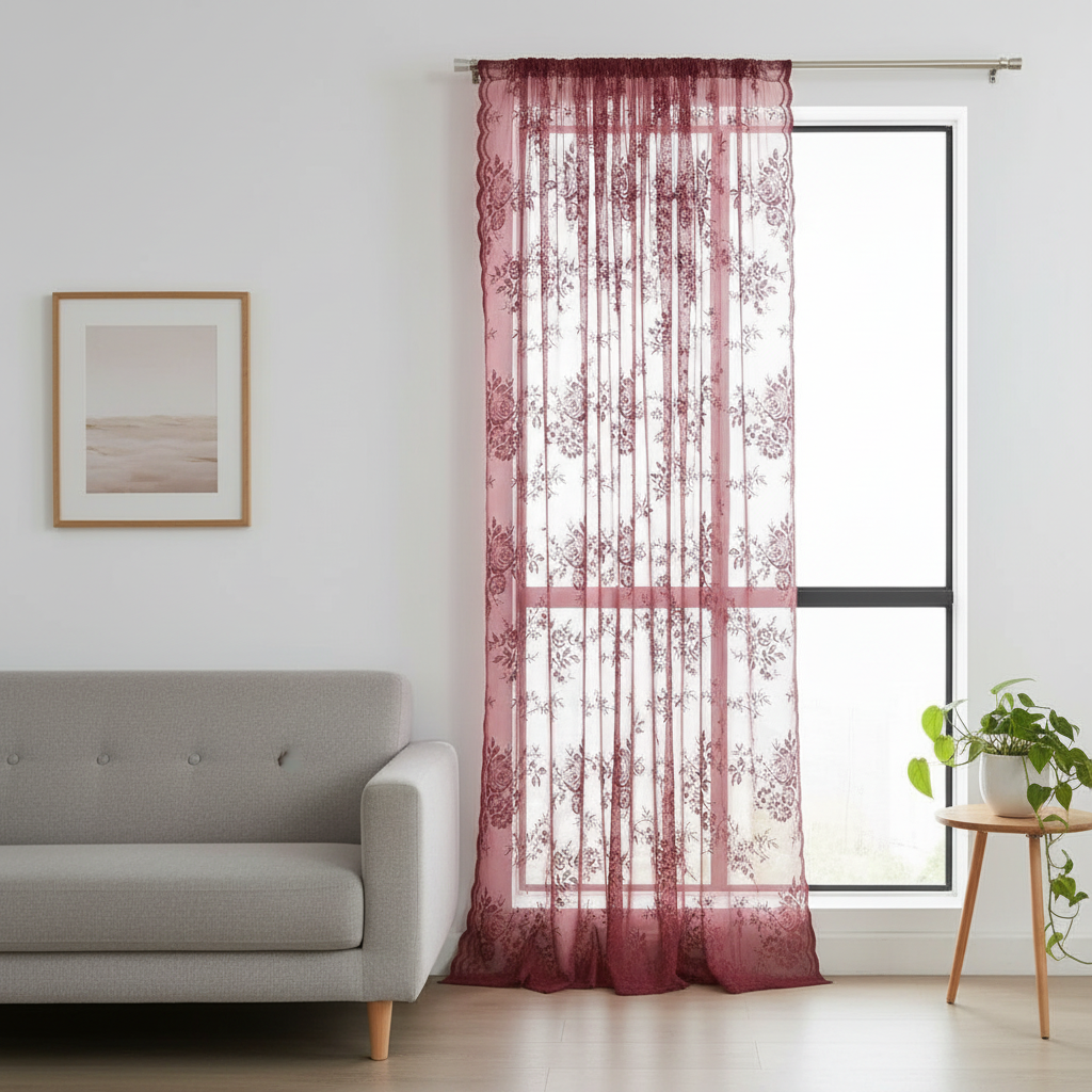 Rose Glow floral lace sheer curtain hung beside a window in a styled living room