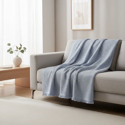 Waffle cotton summer blanket draped over a sofa in a modern room