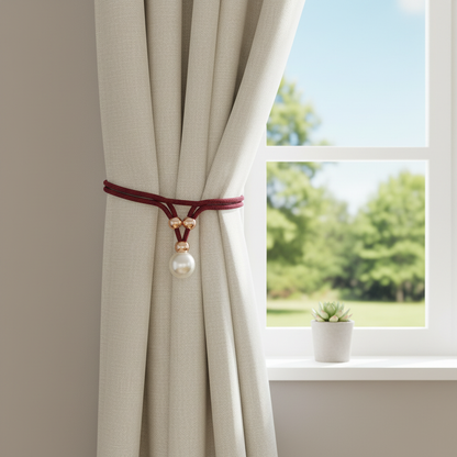 Lustrous pearl curtain tie-back holding back a curtain at a window